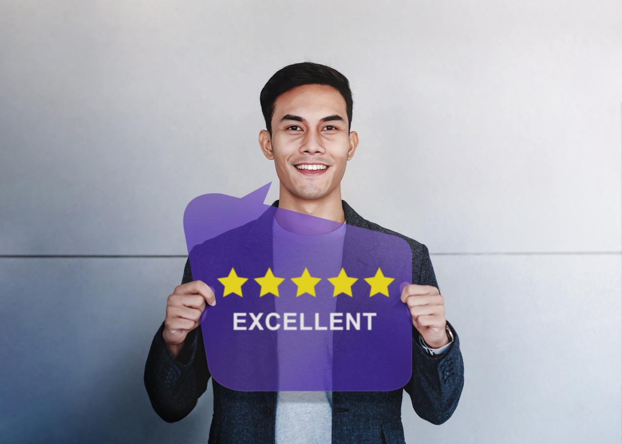 Customer Experiences Concept. Happy Client Showing Five Stars Rating and Positive Review on Speech Bubble Card. Client Satisfaction Surveys and Feedback
